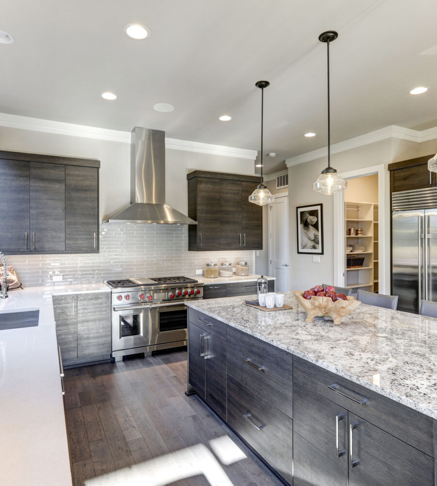 Modern gray kitchen features dark gray flat front cabinets